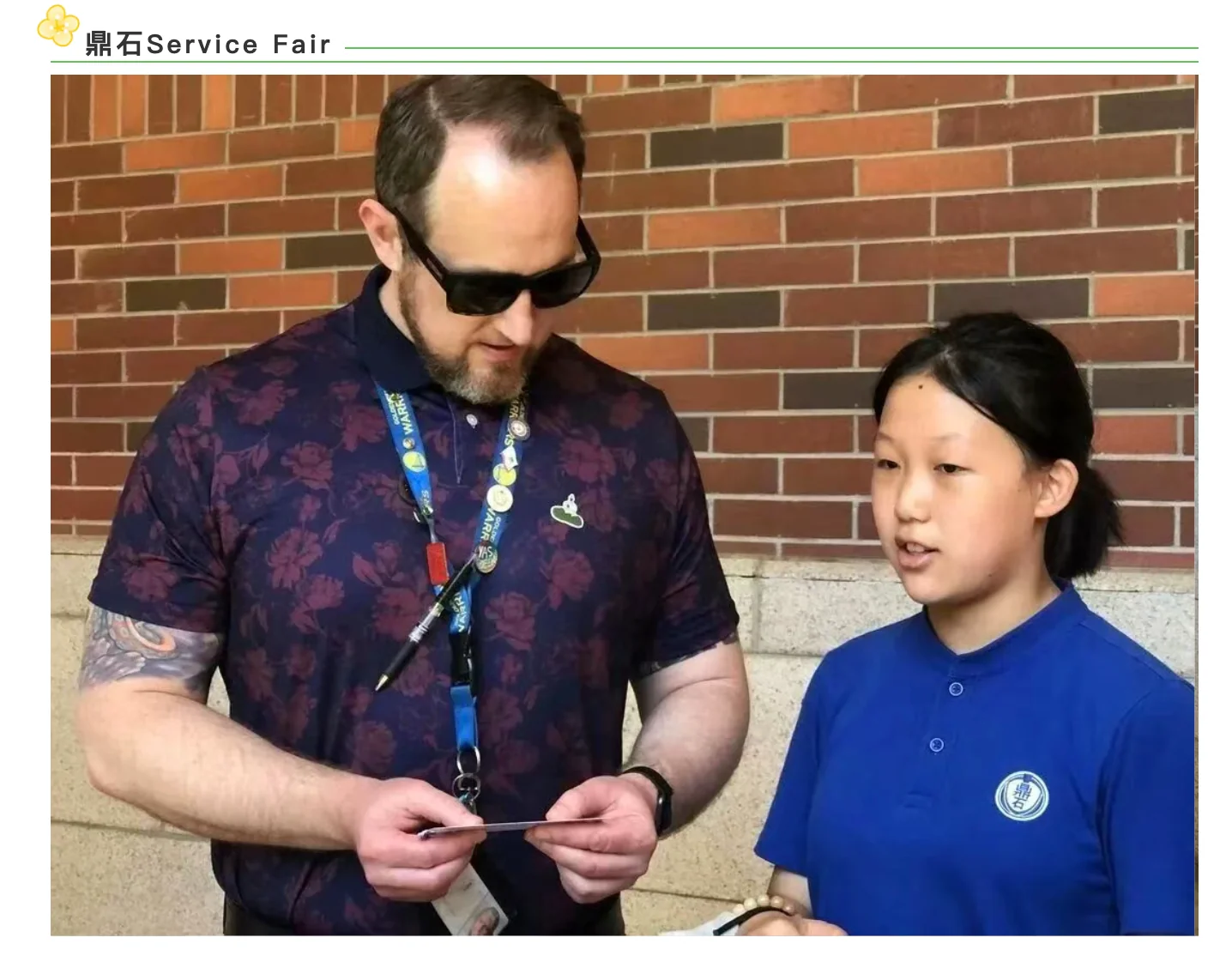 Liya discussing her project with a visitor at the service fair